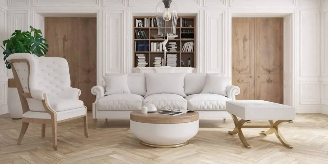 Elegancka sztukateria w nowoczesnym salonie podkreśla jasne meble i drewniane drzwi.