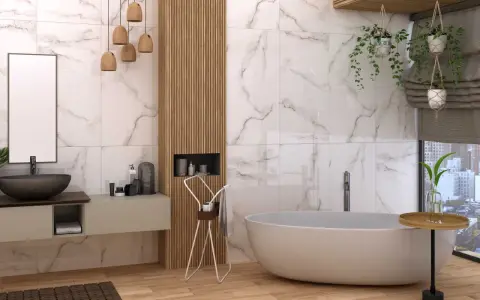 Nowoczesna łazienka z wanną i umywalką. Marmurowe płytki na ścianach sięgają do samej góry, tworząc elegancką przestrzeń.